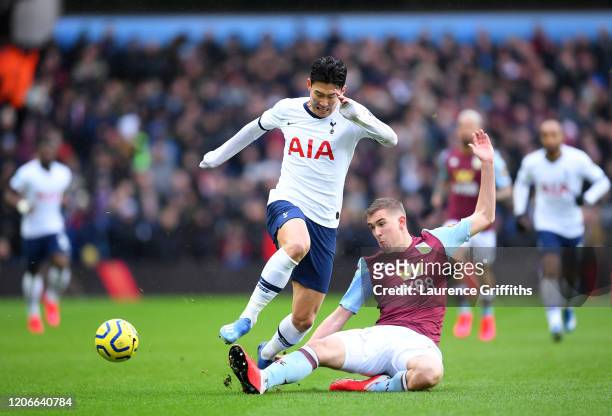 Bjorn Engels of Aston Villa tackles Heung-Min Son of Tottenham Hotspur during the Premier League match between Aston Villa and Tottenham Hotspur at...