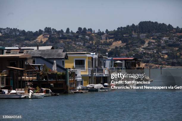 Line of houseboats converge with water and hills on July 7, 2010 in Sausalito, Calif.