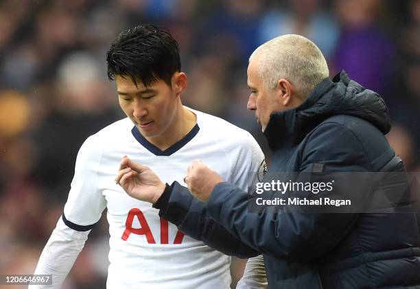 Jose Mourinho, Manager of Tottenham Hotspur speaks with Heung-Min Son of Tottenham Hotspur during the Premier League match between Aston Villa and...