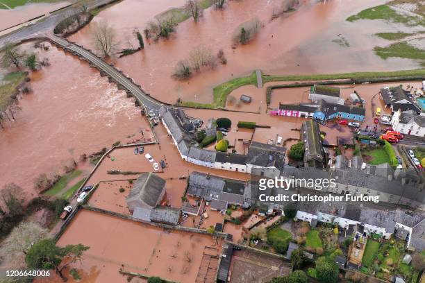 An aerial view of the Welsh village of Crickhowell which has been cut off as the river Usk bursts its banks at Crickhowell bridge near the Bridge End...