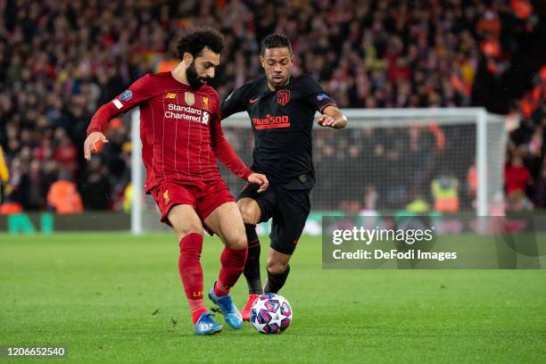 Mohamed Salah of Liverpool FC and Renan Lodi of Atletico Madrid battle for the ball during the UEFA Champions League round of 16 second leg match...