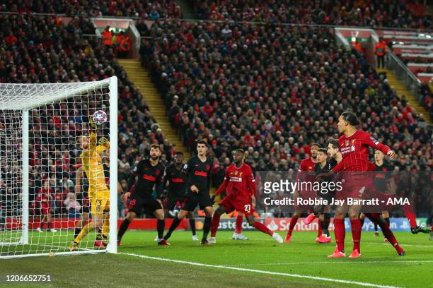 Goalkeeper Adrian of Liverpool saves from Virgil Van Dijk of Liverpool during extra time during the UEFA Champions League round of 16 second leg...