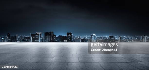 futuristic empty parking ground with urban city skyline high res panorama - horizon over land stock pictures, royalty-free photos & images