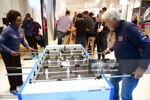 Laureus Academy Member Tegla Loroupe and Dawn Fraser play table football during an interview at the Mercedes Benz Building prior to the Laureus World...
