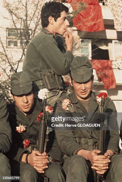 The carnation revolution in Lisbon, Portugal in May 1, 1974 - The soldiers provoke a pacific putsch and put a carnation on their gun.