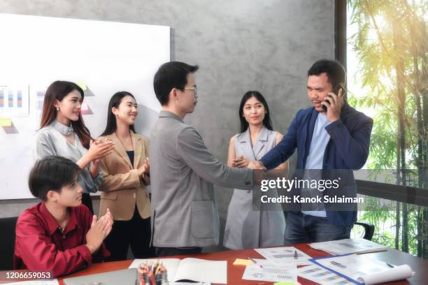 visually impaired professional businessman success with handshakes - love is blind stock-fotos und bilder