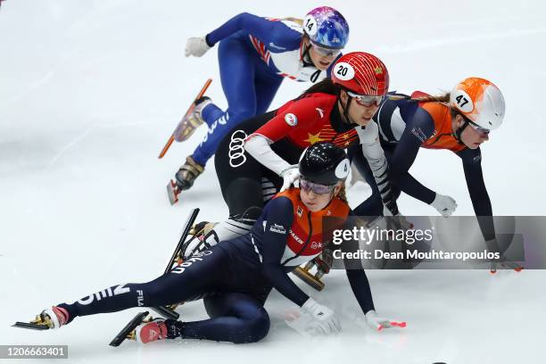 Yara Van Kerkhof and Lara Van Ruijven both of the Netherlands, Chunyu Qu of China and Elise Christie of Great Britain crash on the first corner in...