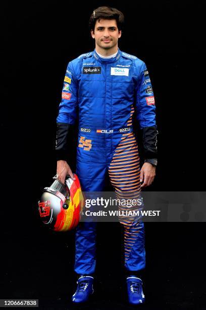 McLaren's Spanish driver Carlos Sainz Jr poses for a photo at the Albert Park circuit ahead of the Formula One Australian Grand Prix in Melbourne on...