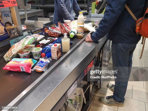 Empty shelves in a Lidl grocery store are seen in Gdansk, Poland on 11 March 2020 After government announced today closing schools, museums, cinemas...