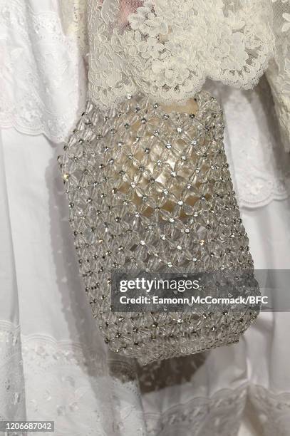 Model, bag detail, walks the runway at the Simone Rocha show during London Fashion Week February 2020 on February 16, 2020 in London, England.