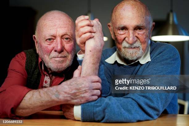 Holocaust survivor, Belgian retired lawyer and pianist Simon Gronowski , and Belgian sculptor and drawer Koenraad Tinel pose during an interview with...