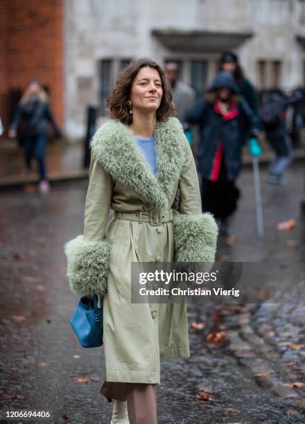 Guest is seen wearing green coat outside Preen during London Fashion Week February 2020 on February 16, 2020 in London, England.