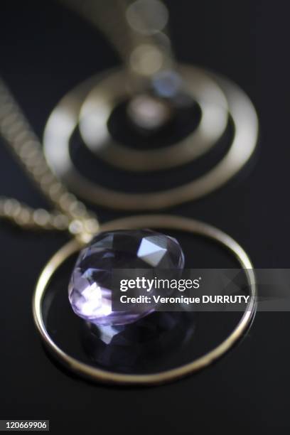 Gold and amethyst pendants in London, United Kingdom - Perle de Lune jewel, created in London by the french gemologist Sandrine Domercq.