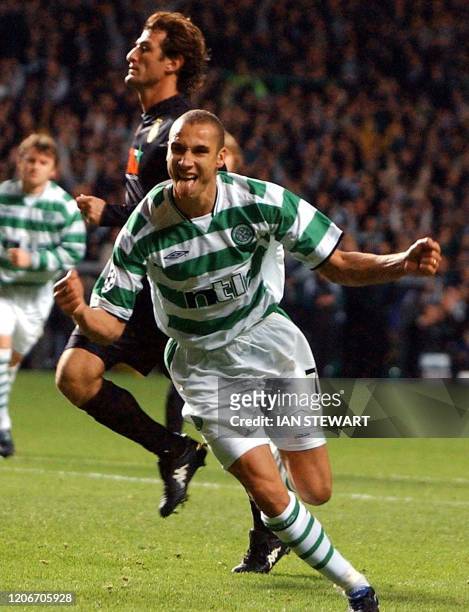 Celtic Glasgow's Swedish striker Hendrik Larsson celebrates after scoring from the penalty spot against Juventus Turin during the UEFA Champions...