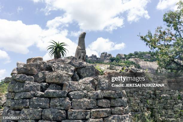 Sculpture of a bird carved from soapstone was temporarily moved from a museum at the same site to be placed back in its original position at the...