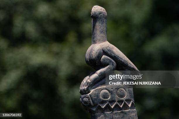 Sculpture of a bird carved from soapstone was temporarily moved from a museum at the same site to be placed back in its original position at the...