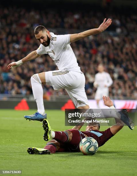 Karim Benzema of Real Madrid is tackled by Jeison Murillo of Celta Vigo during the La Liga match between Real Madrid CF and RC Celta de Vigo at...