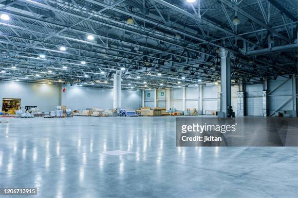 empty modern warehouse - storage room stock pictures, royalty-free photos & images