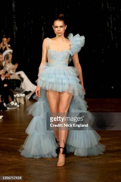 Model walks the runway at the AADNEVIK Fashion Show at London Fashion Week February 2020 at the The Royal Horseguards on February 16, 2020 in London,...