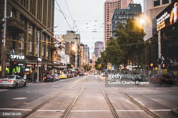 tram tracks in elizabeth street, melbourne - melbourne stock pictures, royalty-free photos & images