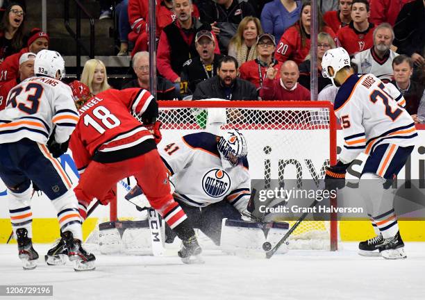 Mike Smith of the Edmonton Oilers makes a save against the Carolina Hurricanes during the third period of their game at PNC Arena on February 16,...