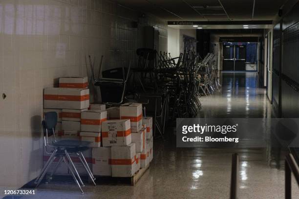 Chairs sits stacked in a hallway at the Albert Leonard Middle School, one of three local schools closed by the coronavirus outbreak, in New Rochelle,...