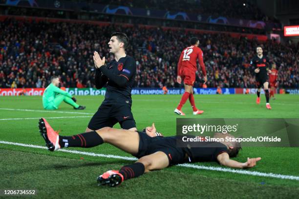 Alvaro Morata of Atletico celebrates after scoring their 3rd goal as teammate Marcos Llorente of Atletico slides in to join him during the UEFA...