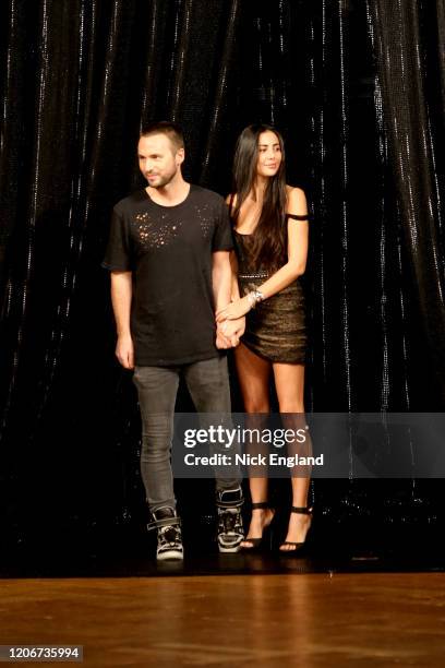 Hila Aadnevik and Kristian Aadnevik walk the runway at the AADNEVIK Fashion show at London Fashion Week February 2020 at the The Royal Horseguards on...