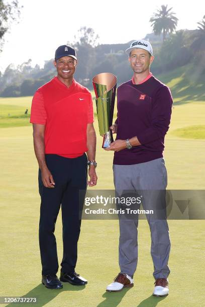 Adam Scott of Australia poses with tournament host Tiger Woods and the trophy after winning the Genesis Invitational on February 16, 2020 in Pacific...