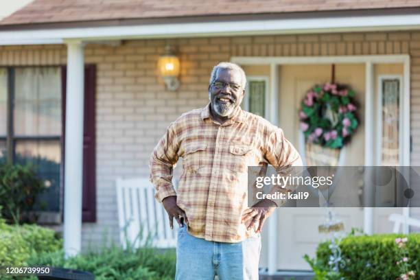 senior man standing in front of home - black man plaid shirt stock pictures, royalty-free photos & images