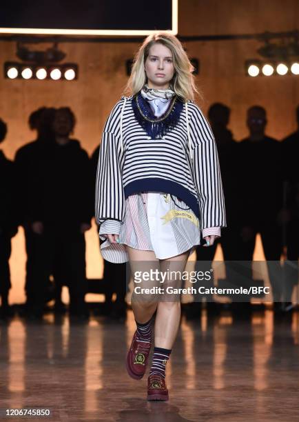 Lottie Moss walks the runway at the TommyNow show during London Fashion Week February 2020 at the Tate Modern on February 16, 2020 in London, England.