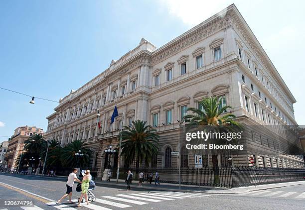 Pedestrians cross the road in front of the Banca D'Italia, Italy's central bank, in Rome, Italy, on Monday, Aug. 8, 2011. European Central Bank...