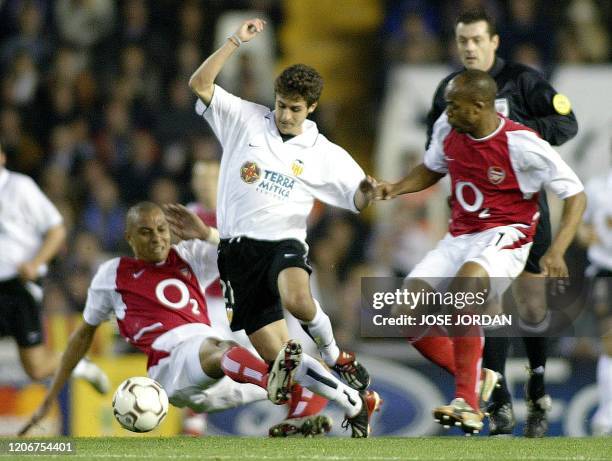 Valencia's Argentinian Pablo Aimar vies with Arsenal's Brazilian Gilberto and French Sylvian Wiltord during their Champions league match group B in...