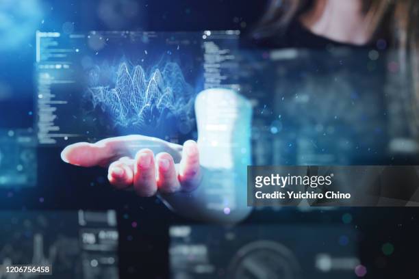 woman using futuristic digital interface display - future health care fotografías e imágenes de stock