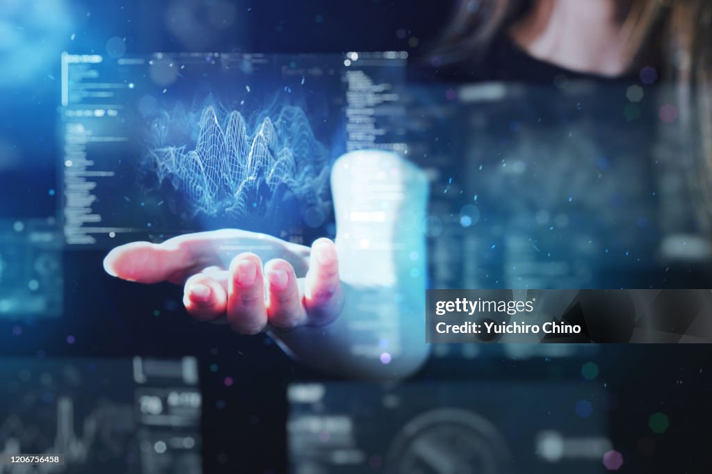 Woman using futuristic digital interface display