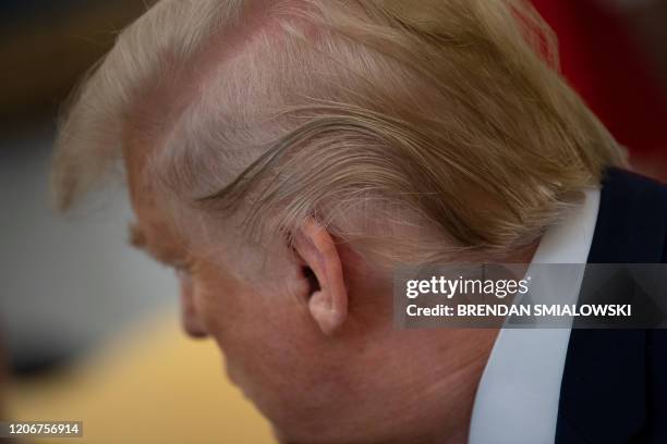 President Donald Trump waits for a meeting with Ireland's Prime Minister Leo Varadkar in the Oval Office of the White House March 12 in Washington,...