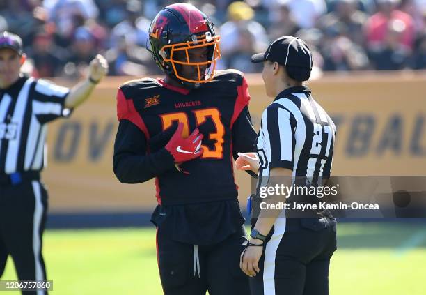 Line judge Maia Chaka stands on the field as she talks with running back Dujuan Harris of the Los Angeles Wildcats as she waits for play to resume at...