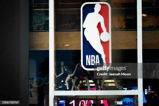 An NBA logo is shown at the 5th Avenue NBA store on March 12, 2020 in New York City. The National Basketball Association said they would suspend all...