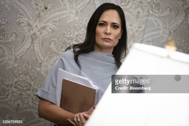 Stephanie Grisham, White House Press Secretary, listens during a meeting with U.S. President Donald Trump in the Oval Office of the White House in...