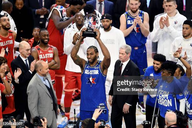 Kawhi Leonard of Team LeBron celebrates with the trophy after being named the Kobe Bryant MVP during the 69th NBA All-Star Game at the United Center...