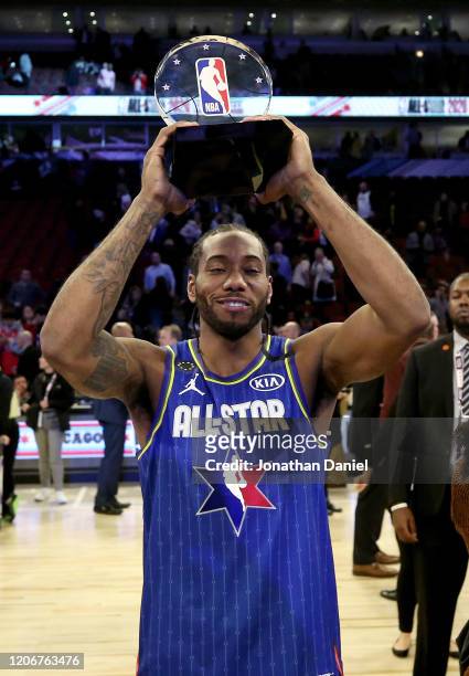 Kawhi Leonard of Team LeBron celebrates with the trophy after being named the Kobe Bryant MVP during the 69th NBA All-Star Game at the United Center...