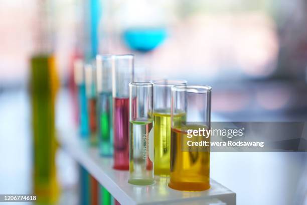 glassware test tubes laboratory equipment filled the colorful liquid - chemical products stock-fotos und bilder