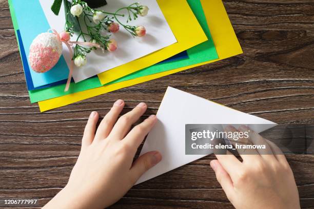 Origami instruction, step 2. The child fold the origami Easter chick. Handmade. The project of children's creativity, crafts, crafts for children.
