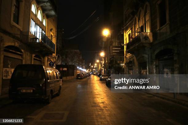 Photograph taken on March 12, 2020 shows Gouraud street in the Lebanese capital Beirut's Gemayzeh district, known for its bustling nightlife, empty,...