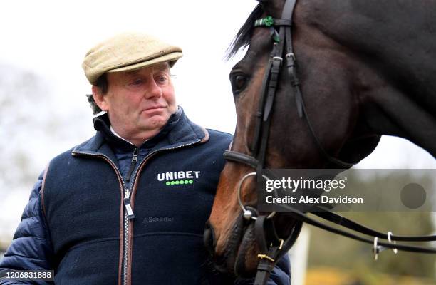 Trainer Nicky Henderson poses for a photo with Altior, hopeful for the Betway Queen Mother Champion Chase during a Nicky Henderson Stable Visit at...