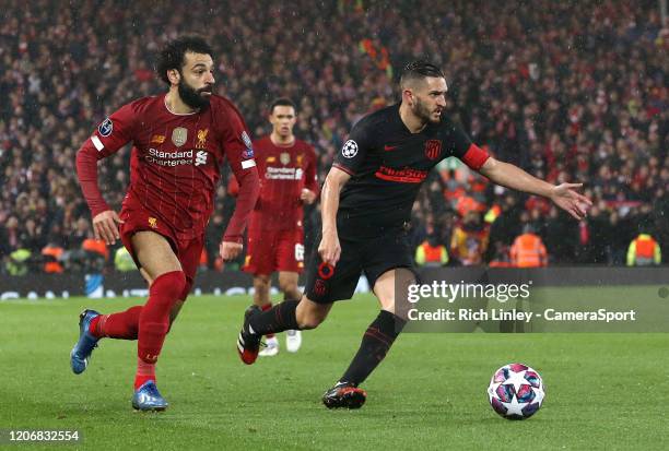 Atletico Madrid's Koke under pressure from Liverpool's Mohamed Salah during the UEFA Champions League round of 16 second leg match between Liverpool...