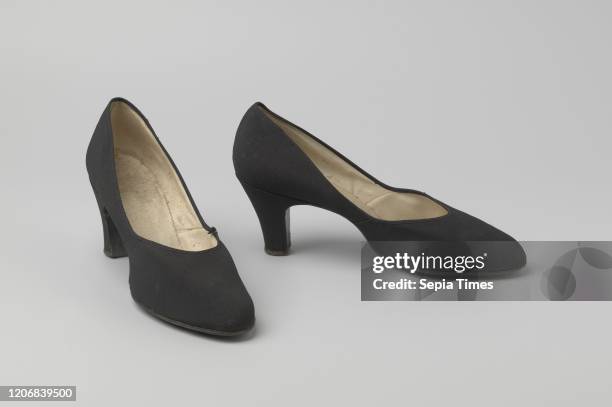 Pump made of black ripped silk with high heel, Ladies shoe made of black ripped silk. Model: The rounded pointed nose, one front sheet and two side...