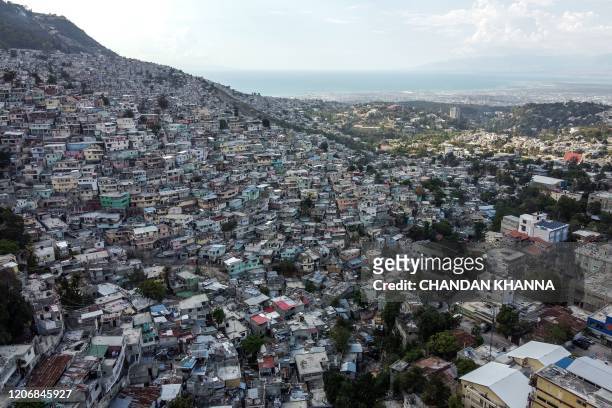 Aerial view of the high density of houses in the neighbourhood of Jalousie in Port-au-Prince, on March 12, 2020.