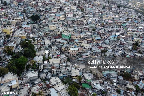 Aerial view of the high density of houses in the neighbourhood of Jalousie in Port-au-Prince, on March 12, 2020.