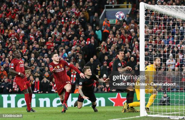 Liverpool's Andrew Robertson's headed effort hits the crossbar during the UEFA Champions League round of 16 second leg match between Liverpool FC and...